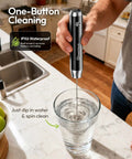 Person using LunaFro Handheld Milk Frother With Stand, Rechargeable, Waterproof Stainless Steel Whisk in a glass in kitchen