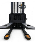 Front view of Fully Electric Thin Leg Pallet Stacker With 130 Inch Height Capacity And 3307 Pound Payload, showing forks ready for use.