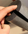 Self-Sealing Pipe Insulation Foam Tube for Outdoor Water Lines with Antifreeze Aluminum Foil Heat Shield, shown in hand.