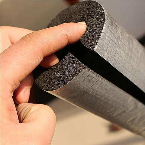 Self-Sealing Pipe Insulation Foam Tube for Outdoor Water Lines with Antifreeze Aluminum Foil Heat Shield, shown in hand.