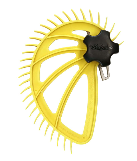 The Hedgehog featherboard for table saws by Amazon; yellow curved plastic with many tines and a black knob