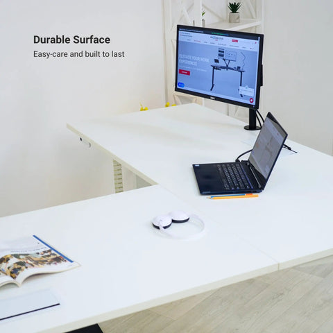 Game Changer Electric Lift L Shaped Standing Desk 88 Inch Wide Corner Office Table with laptop and monitor setup on durable surface.