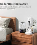 Bedroom setup with 20 Amp 125 Volt Tamper Resistant Decorator Outlet Receptacle With Grounding White UL Listed next to a bed and humidifier.