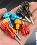 Hand holding multicolored CNC machined aluminum thumb screws for action cameras, compatible with Hero and Insta360 standard mounts.