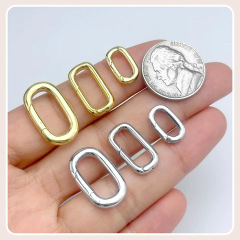10Pcs Carabiner Clip Pendant Clasps in 18K Gold Tone for Necklaces and Bracelets with coin for size reference on hand