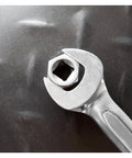 Wrench holding bolt attached to Spiral Type Deep Bolt Extractor Set, Five Piece, Chrome Vanadium Steel Construction tool.