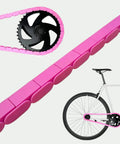 Pink Solid Toddler Bicycle Chain Cover Snap On No Tools Required Protects Clothing From Chain Lube For Single Speed And Fixed Gear Bikes Only Easy Installation on a white bike.