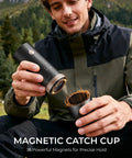 Portable Burr Coffee Grinder With 80 Precision Settings For Single Dose Brewing Compact Travel Mill Hella Sharp Grinds For Espresso Moka Pot And Pour Over Solid Sip Life On The Go, shown in use outdoors.
