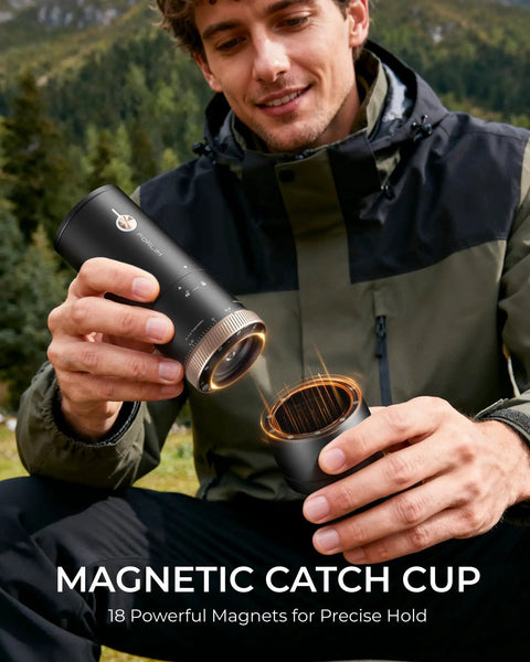 Portable Burr Coffee Grinder With 80 Precision Settings For Single Dose Brewing Compact Travel Mill Hella Sharp Grinds For Espresso Moka Pot And Pour Over Solid Sip Life On The Go, shown in use outdoors.