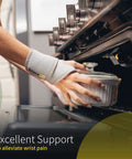 Adjustable Wrist Wrap For Men And Women, Carpal Tunnel Relief, left hand wearing neoprene wrist brace while using oven