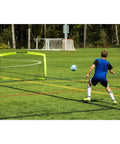 Boy playing soccer with Portable Backyard Soccer Goal Small Size Pop Up With Quick Setup Durable Fiberglass Frame All Weather Practice Net For Training And Small Sided Kickaround Games With Friends Perfect For Driveway Or Lawn on grassy field