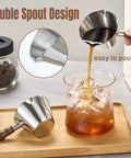 Pouring coffee from 2 Piece Espresso Cup Set With Handle For Barista Level Pouring, 3.4 Oz Stainless Steel Cups, silver.