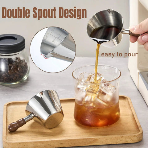 Pouring coffee from 2 Piece Espresso Cup Set With Handle For Barista Level Pouring, 3.4 Oz Stainless Steel Cups, silver.