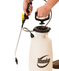 Three-Gallon Premium Lawn And Garden Sprayer With Three Nozzle System being assembled, featuring ergonomic handle and pressure release cap