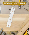 Flat Metal Connecting Plates Set 50 Pcs Iron Hardware Joining Brackets on wood with tools in workshop setting
