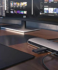 Thunderbolt 3 Dock For Laptop Users delivers snazzy desk setups with USB-C hub, connected to a laptop and monitor.