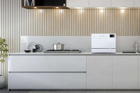 Top Notch Compact Countertop Dishwasher Fits Right Into Any Kitchen Scrubbing Dishes Clean Hassle Free With Energy Star Rating Delay Start LED Panel And Crisp White Exterior in modern kitchen with stove.