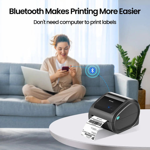 Bluetooth Thermal Shipping Label Printer For 4x6 Rolls And Wide Fan Fold Paper With Spacious Built In Storage Tray on table, printing labels.