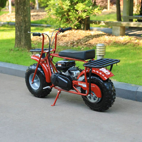 Red mini bike with beefed up header exhaust pipe kit in a park setting, compatible with Predator 212cc and GX160 clone engines.