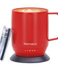 Grab This Solid Self Heating Coffee Mug To Keep Your Morning Sips Piping Hot With Smart Temperature Controls And A Ridiculously Long Battery Built From Premium Stainless Steel For Office Or Travel Cherry Red, displaying a red stainless steel mug with a latte art top and base.