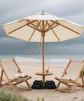 Beach scene with umbrella and chairs stabilized by Two Pack 45 Lbs Heavy Duty Umbrella Base Sand Bags For Patio And Cantilever Stands.