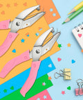2 Pack Handheld Hole Punch Set With Heart And Star Shape Punches, Stainless Steel Construction, on colorful craft paper