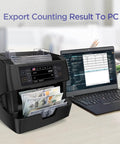 Ultra Fast Money Counter Machine With 1500 Bills Per Minute, Mixed Denominations beside laptop exporting data