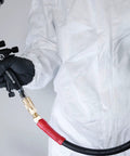 Person using Ultra Durable 3/8-Inch By 100 Foot Rubber Air Hose With Heavy Duty Reinforced Lining and industrial brass fittings