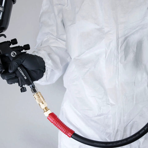 Person using Ultra Durable 3/8-Inch By 100 Foot Rubber Air Hose With Heavy Duty Reinforced Lining and industrial brass fittings
