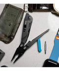 Everyday Carry 7 Tools Multi-Tool in CRYO D2 Steel with compact pocket size, stainless steel housing, urban gray and cyan finish