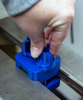 Kickass Adjustable Dust Collection Rig For Split Bed Wood Lathes With Tight Four Inch Hose Hookup and Three Way Flex Brackets shown in use with blue snug mount