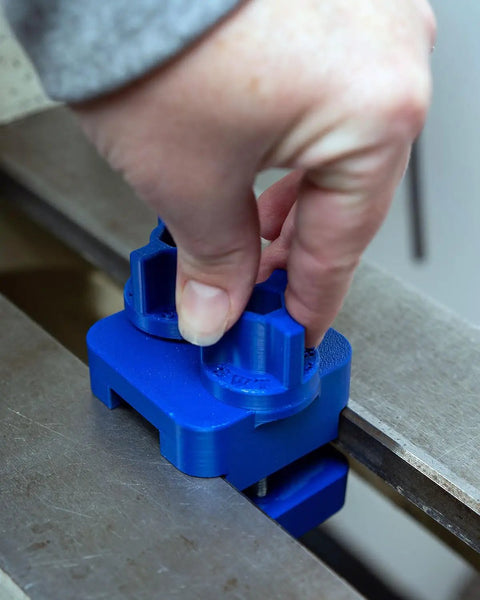 Kickass Adjustable Dust Collection Rig For Split Bed Wood Lathes With Tight Four Inch Hose Hookup and Three Way Flex Brackets shown in use with blue snug mount