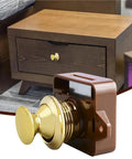 Rugged RV Push Latch Set for Drawer and Cabinet shown with metal button lock and wooden drawer in the background.