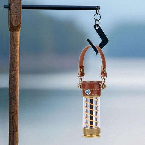 Camping Light Strap Set Carrier Portable Hand Lamp Belt with brown PU leather strap hanging on hook outdoors.