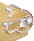 Super Soft Transparent Baby Corner Protectors For Kiddos And Toddlers With Crystal Clear Baby Proof Furniture Edges Smooth As Butter No Sweat Install 12 Pack on wooden edge.