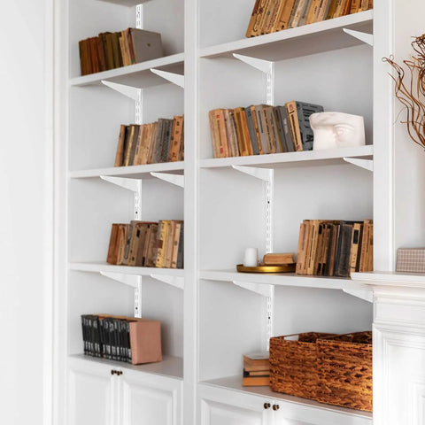 Premium Heavy Duty 60 Inch Shelf Pilasters 5 Pack Dual Track Upright Wall Shelving System Featuring Twin Slot Rails And Hardware For Killer Closet And Cabinet Organization Storage Solutions Silver supporting wooden books in a stylish white cabinet.