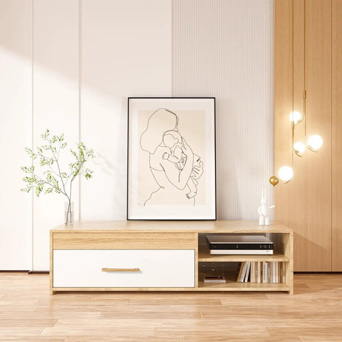 Minimalist living room with wooden console, wall art, glass vase with greenery, pendant lights, and wooden paneling background.