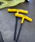 Close-up of dual yellow-handled hex keys from Ten Piece Hex T Handle Set With Stand Includes Sizes 3/32 Through 3/8 Inch Cushioned Ergonomic Grip Pro Grade Tools Built Tough Made In The USA For Pro Techwork And Home Repairs.