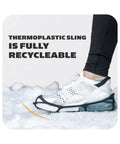 Person wearing Top Shelf Snow And Ice Walking Traction Cleats over sneakers in the snow, showcasing thermoplastic design.
