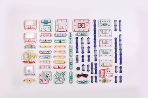 Ultimate STEM Electronics Kit For Kids Ages 8 And Up With 999 Projects In One Mega Circuit Set Includes 64 Components And Full Color Step By Step Manuals For Hands On Experiments Without Soldering Learn Physics And Electronics At Home. assorted circuit components laid out on white background