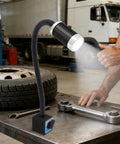 Super Bright 9W Led Machine Tool Light With Magnetic Base And Flexible Gooseneck illuminating a workbench with tire and tools.