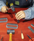 Leather Die Punch Cutter Set In Steel With Hollow Punch Tools For Cutting Leather on crafting table with person using hammer