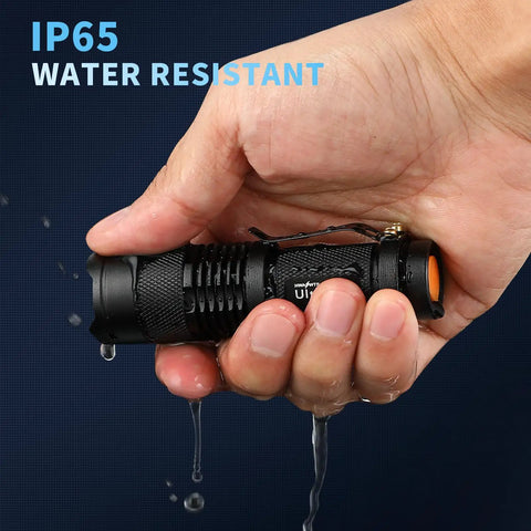 Person holding a 5 Pack SK68 Tactical Flashlights, 7W LED, 3-Mode Pocket Torch with water resistance and adjustable focus.