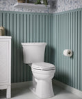 Kelston Revolution 360 Toilet Tank 1.28 GPF White With Left Hand Trip Lever AquaPiston Canister in bathroom setup