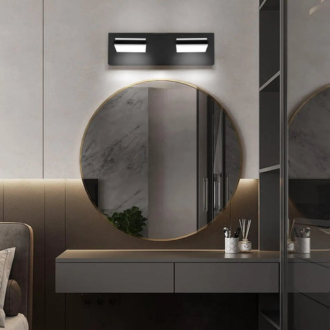 Two Light Bathroom Vanity Light In Matte Black Modern 16W LED Dimmable Over Mirror With 350 Degree Adjustable Head Cold White 6000K ETL Listed 15.5 Inch installed above round mirror in modern bathroom.