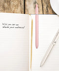 Retractable Gel Ink Pens With Refills For Smooth Quick Dry Writing Leak Free And Smudge Resistant Office And School Supplies shown with notebook.