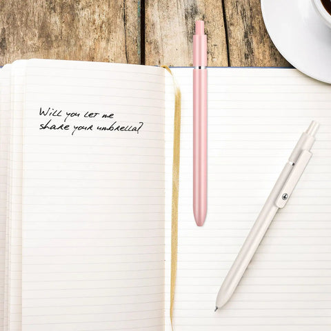 Retractable Gel Ink Pens With Refills For Smooth Quick Dry Writing Leak Free And Smudge Resistant Office And School Supplies shown with notebook.