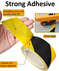 A hand holding Six Rolls Black And Yellow Caution Tape 2In By 108Ft Floor Marking Tape, demonstrating strong adhesive properties.