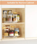 Two Pack Clear 9 Inch Lazy Susan Turntable Rotating Organizer Tray For Cabinet And Countertop Use Non Slip Round Spice Rack Refrigerator Kitchen Pantry Bathroom Storage displaying spices and jars in a narrow cabinet.
