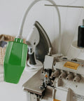 Workhorse Green Workbench Light Cover For Drill Press And Sewing Machine Shop Lamp Shade mounted over a sewing machine.
